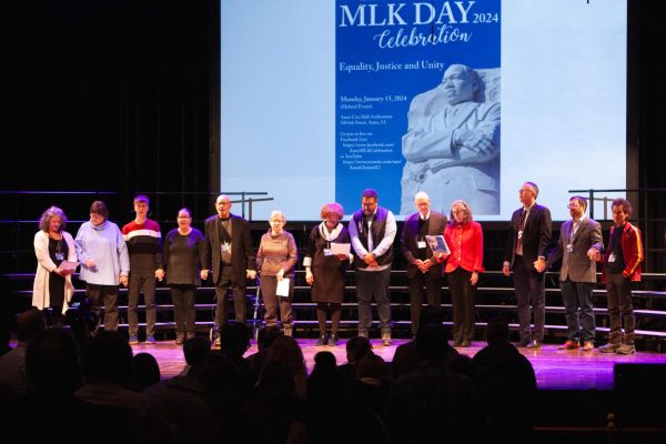The 2024 MLK Committee leads the song, We Shall Overcome, at the Ames/ Story County Community Celebration for Dr. Martin Luther King, Jr. Day at Ames City Hall on Jan. 15, 2024.