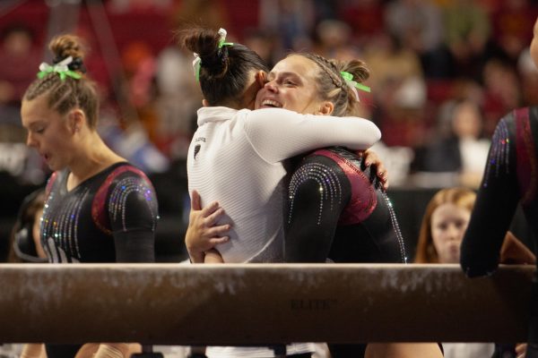 Iowa State gymnasts Madelyn Manternach and Emilie Hong embrace after a Cyclone victory over BYU in Hilton Coliseum on Jan. 19, 2024.