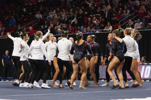 The Iowa State gymnastics team dances to the Juicy Wiggle after their meet against BYU at Hilton Coliseum on Jan. 19, 2024.