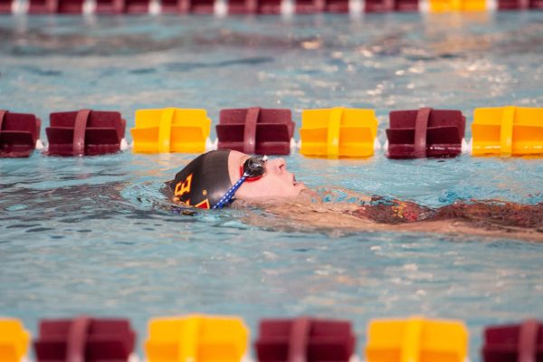 A member of the Iowa State Swim and Dive team warms up during the Iowa State vs. TCU meet on Jan. 20, 2024.