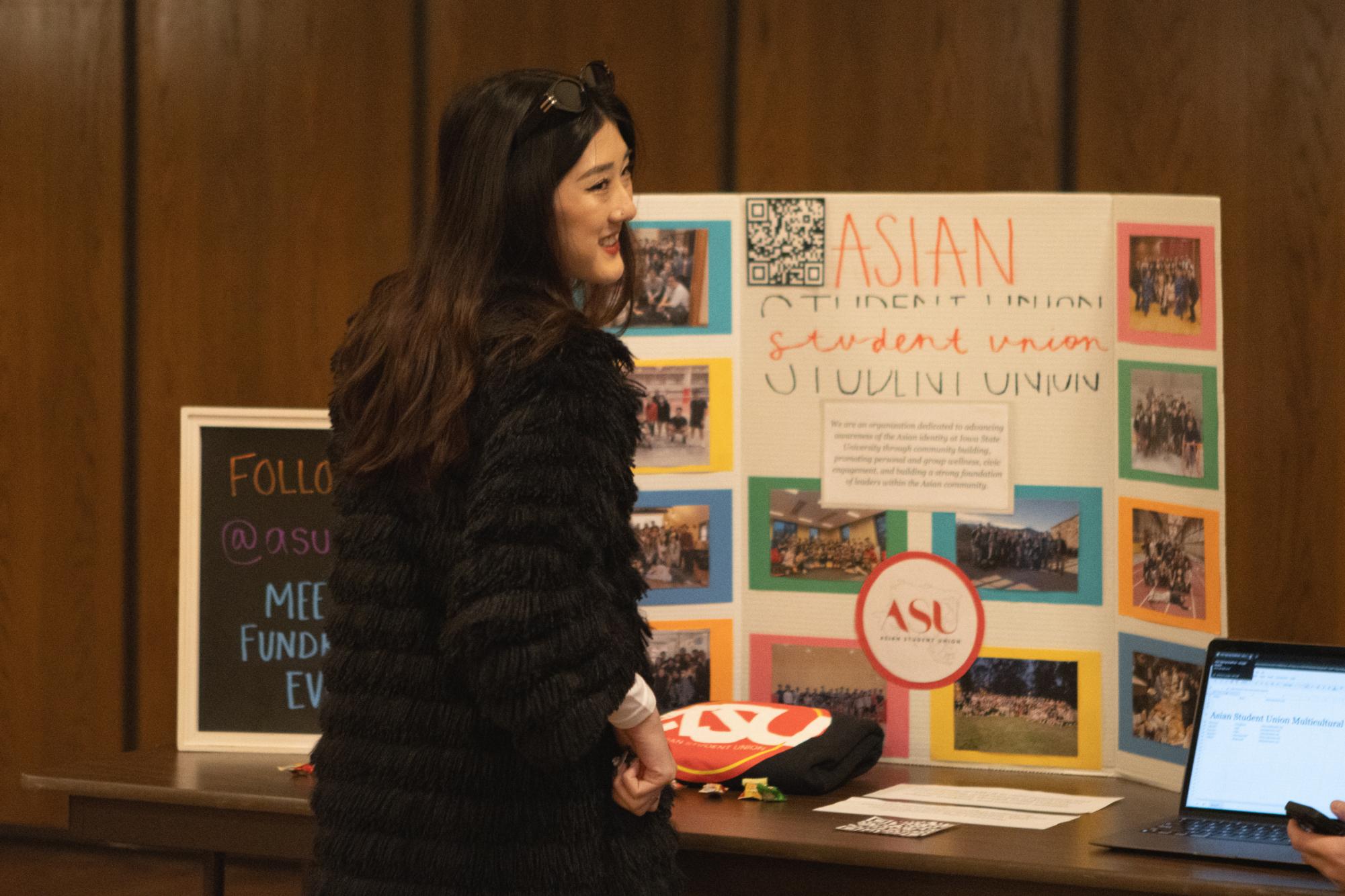 An Iowa State student checks out the Asian Student Union station at the 2024 Multicultural Club Fair in the MU on Jan. 30, 2024.