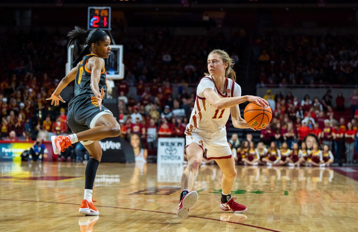 Emily+Ryan+passing+around+a+Oklahoma+State+defender+during+the+Iowa+State+vs.+Oklahoma+State+game+in+Hilton+Coliseum%2C+Jan.+31%2C+2024.