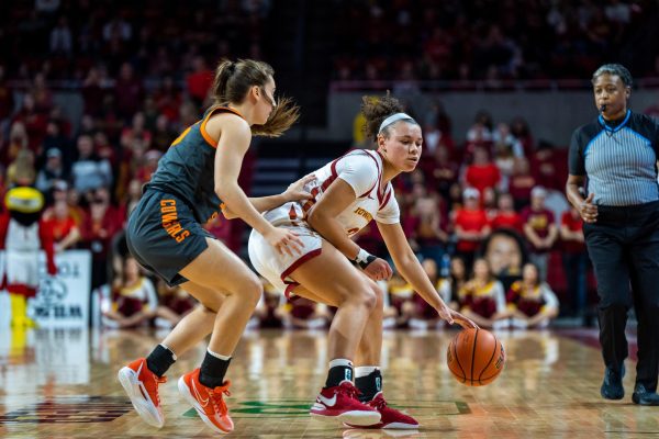 Arianna Jackson trying to dribble into the paint during the Iowa State vs. Oklahoma State game in Hilton Coliseum, Jan. 31, 2024.