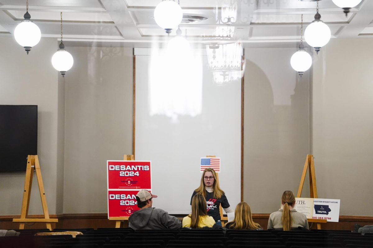 Iowa State Agricultural and Rural Policy Studies sophomore, Emily Meyer, speaks with district 19 attendees during the 2024 Iowa Republican Caucus, Memorial Union, Jan. 15, 2024.