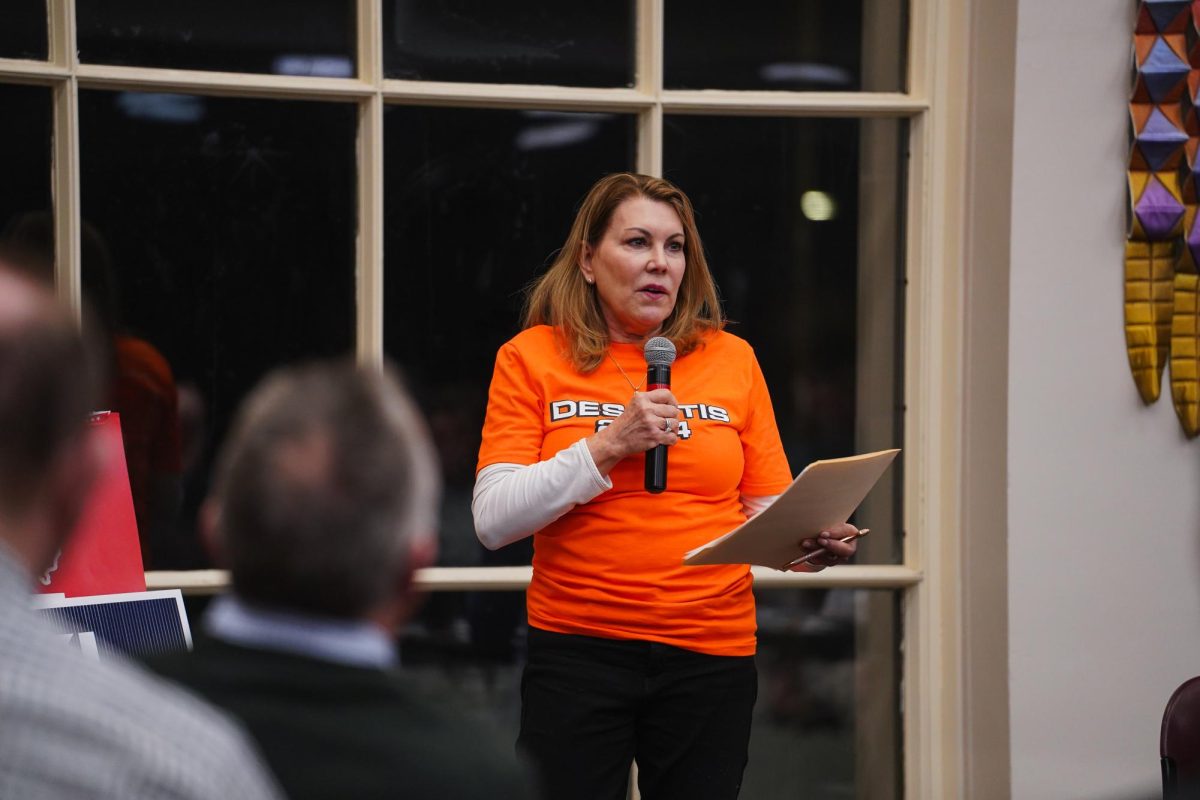 Cindy Stark, the Caucus captain for Ron DeSantis, speaks during their allotted time before voting in the 2024 Iowa Republican Caucus, Memorial Union, Jan. 15, 2024.