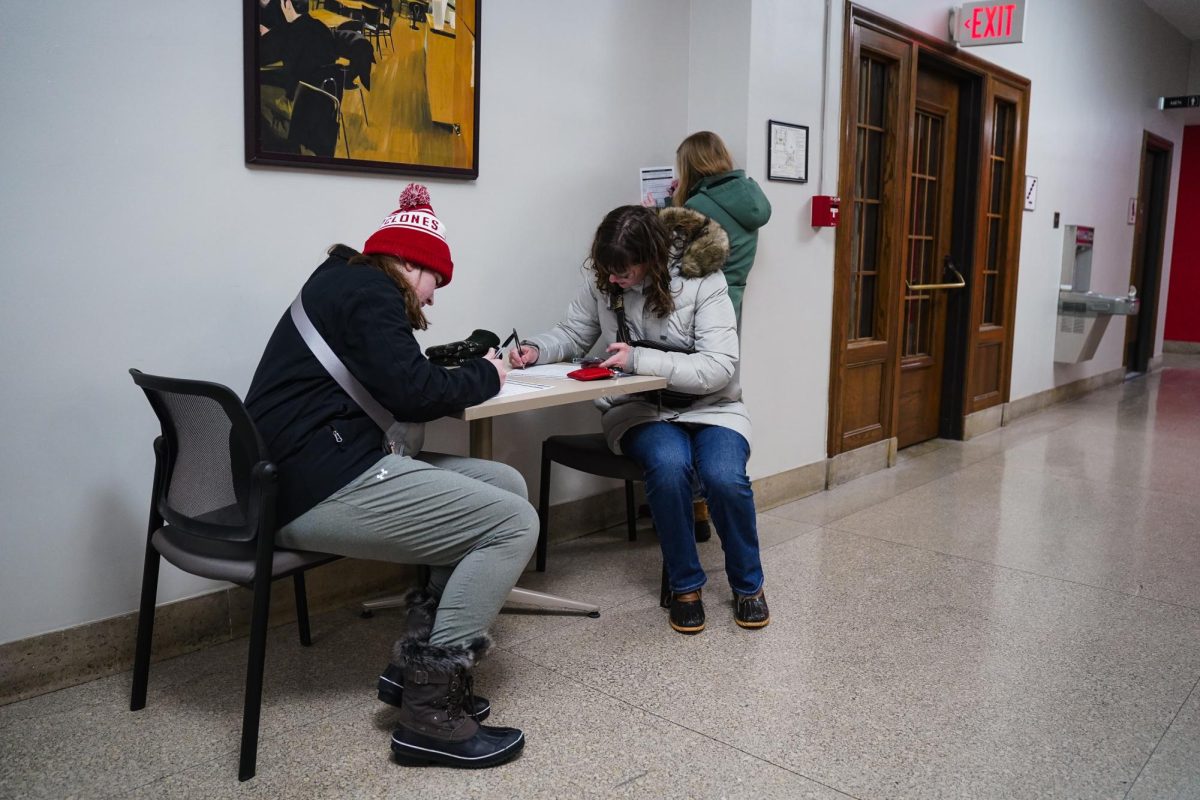 Iowa State students register to vote before taking part in the 2024 Iowa Republican Caucus, Memorial Union, Jan. 15, 2024.