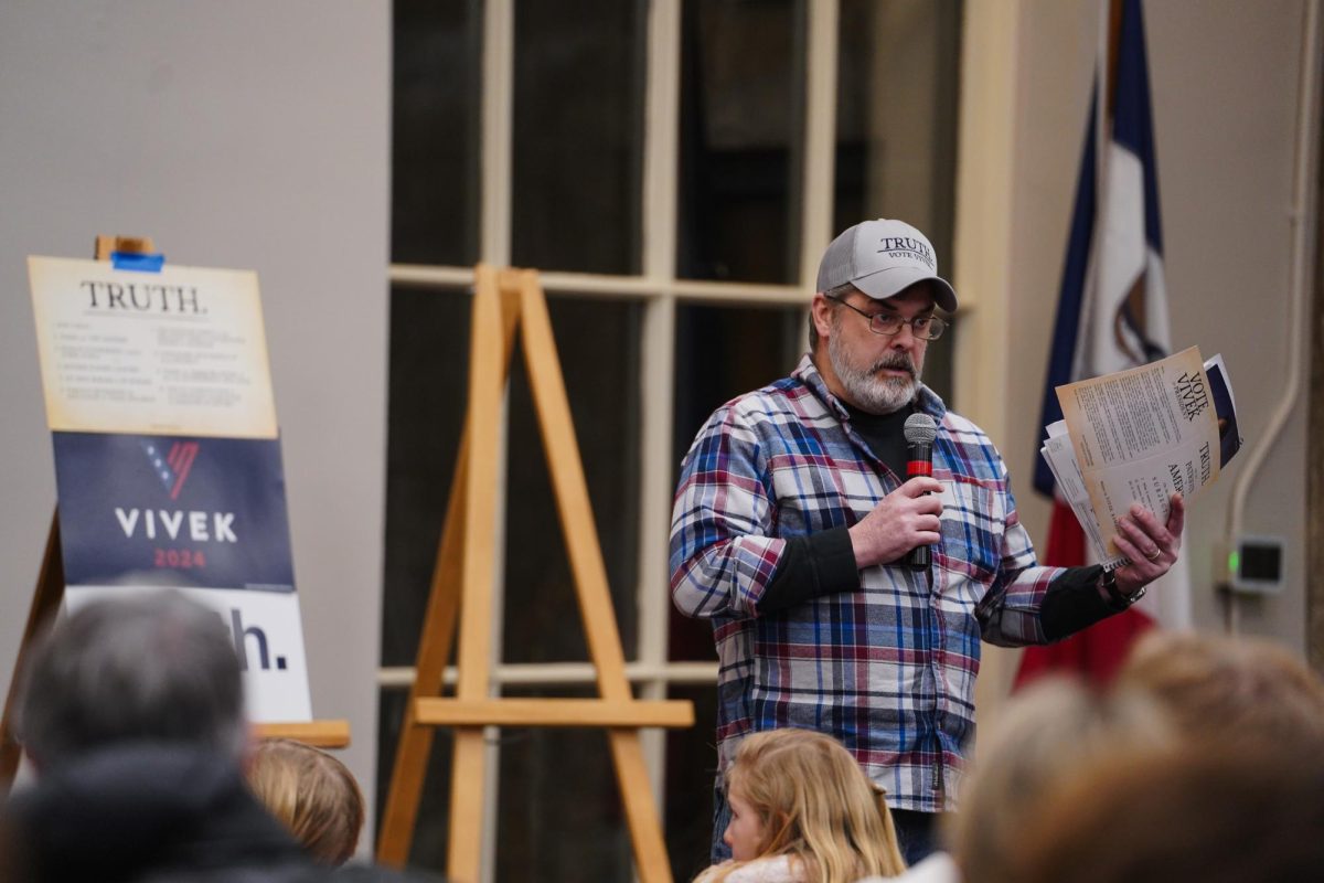 Dan Runyon, the Vivek Ramaswamy Caucus captain, speaks for their allotted time before voting in the 2024 Iowa Republican Caucus, Memorial Union, Jan. 15, 2024.