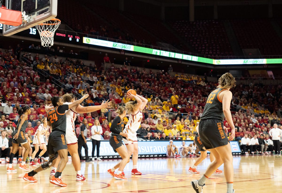 Addy Brown goes to pass the ball at a teammate at the Iowa State vs. Oklahoma State womens basketball game at Hilton Coliseum, Jan. 31, 2024.  