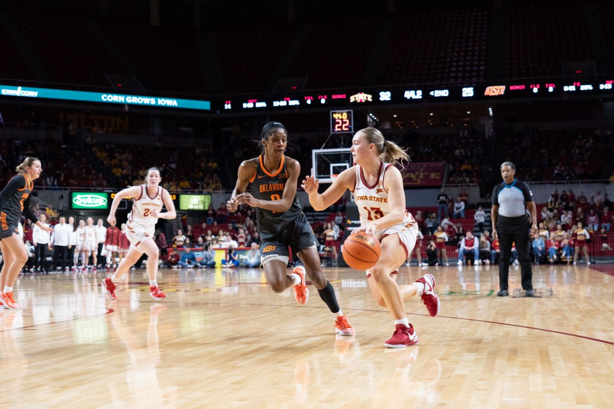 Hannah Belanger dribbles past Quincy Noble at the Iowa State vs. Oklahoma State womens basketball game at Hilton Coliseum, Jan. 31, 2024.  
