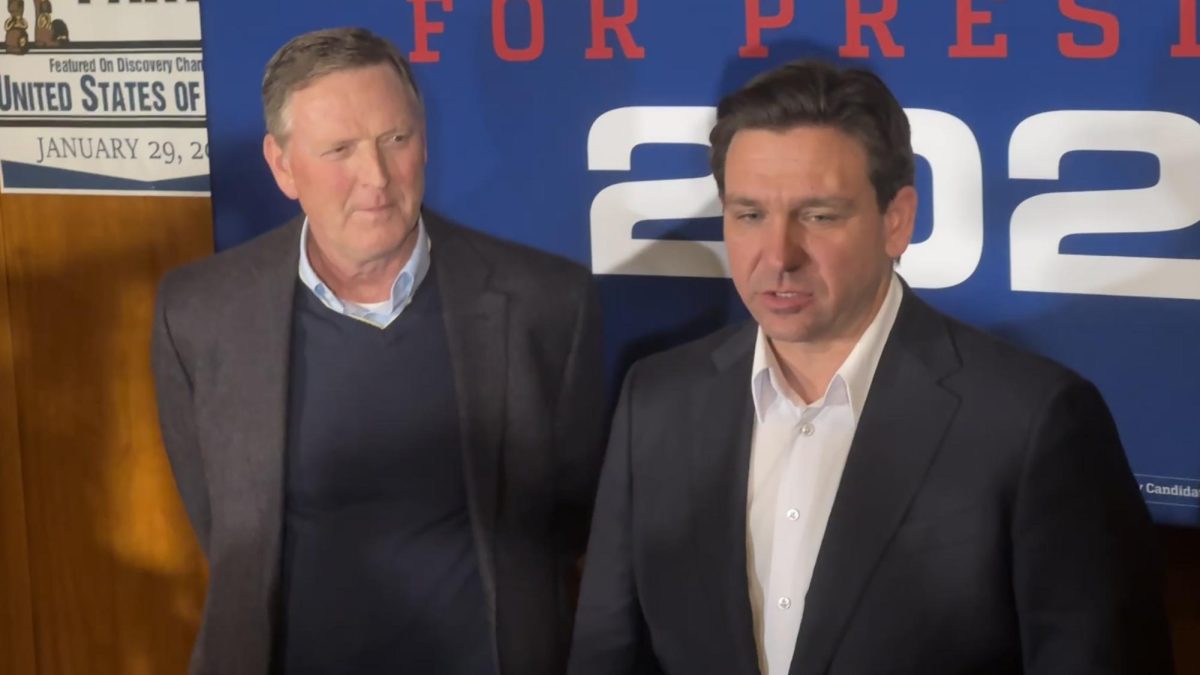 Family Leader CEO Bob Vander Plaats stands next to Florida Gov. Ron DeSantis at a news gaggle following a campaign rally at Jethro’s in Ames on Jan. 11, 2023.