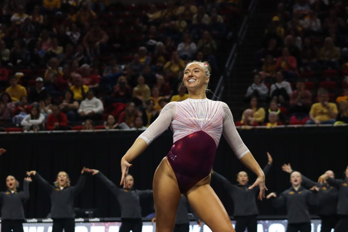 Laura Cooke smiles big while performing her floor routine at the Cyclones vs Illinois State University gymnastics meet at Hilton Coliseum, Jan. 26, 2024.  