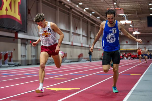 Iowa State runner Gable Sieperda gives it his all to outrun Drake Universities Aziz Jdai during the mens 1 mile event at the 2024 Cyclone Open on Jan. 19, 2024.
