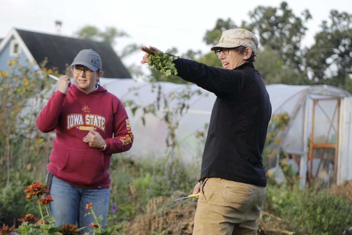 Mustard Seed founder Alice McGary (right) instructs Farm Team member Amy Logan (left) on group harvest tasks Oct. 27, 2023.  