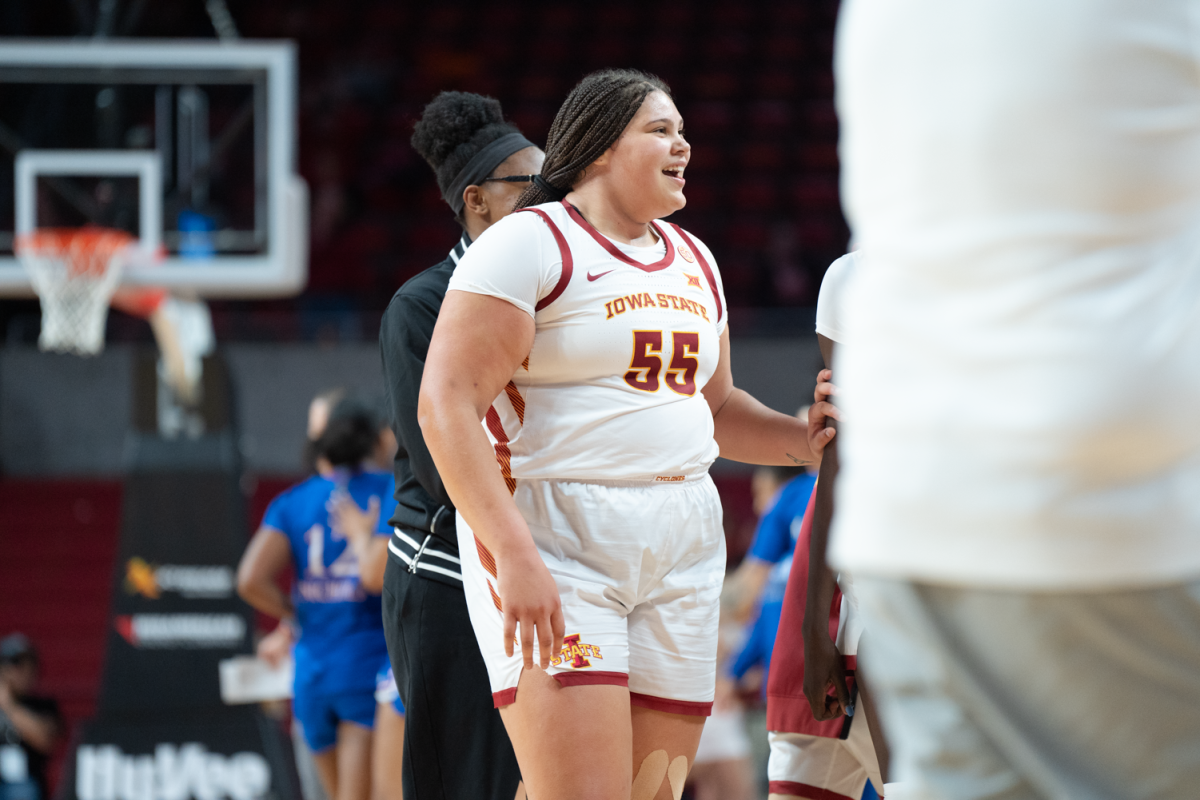 Audi Crooks celebrates with her team after an Iowa State run in the second half against Kansas at Hilton Coliseum on Jan. 3, 2023.