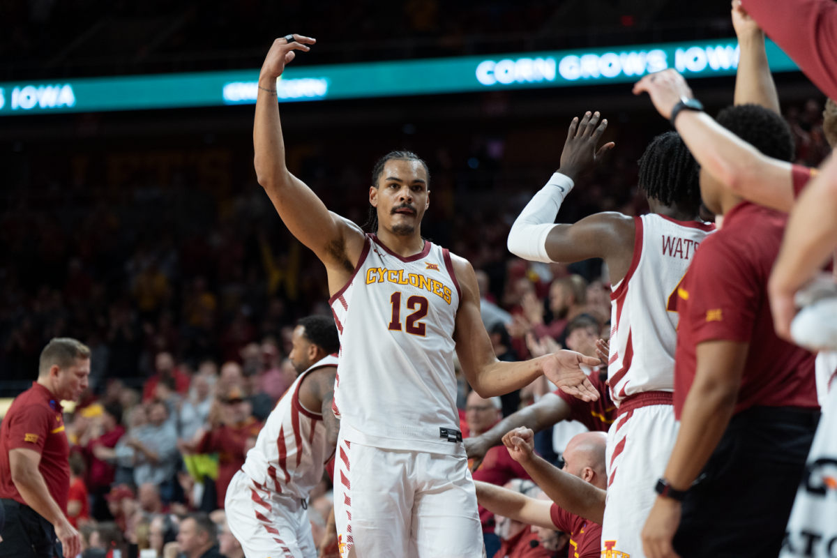 Robert Jones urges the crowd to get on their feet after making 4 consecutive free throws against Houston at Hilton Coliseum on Jan. 9, 2023.
