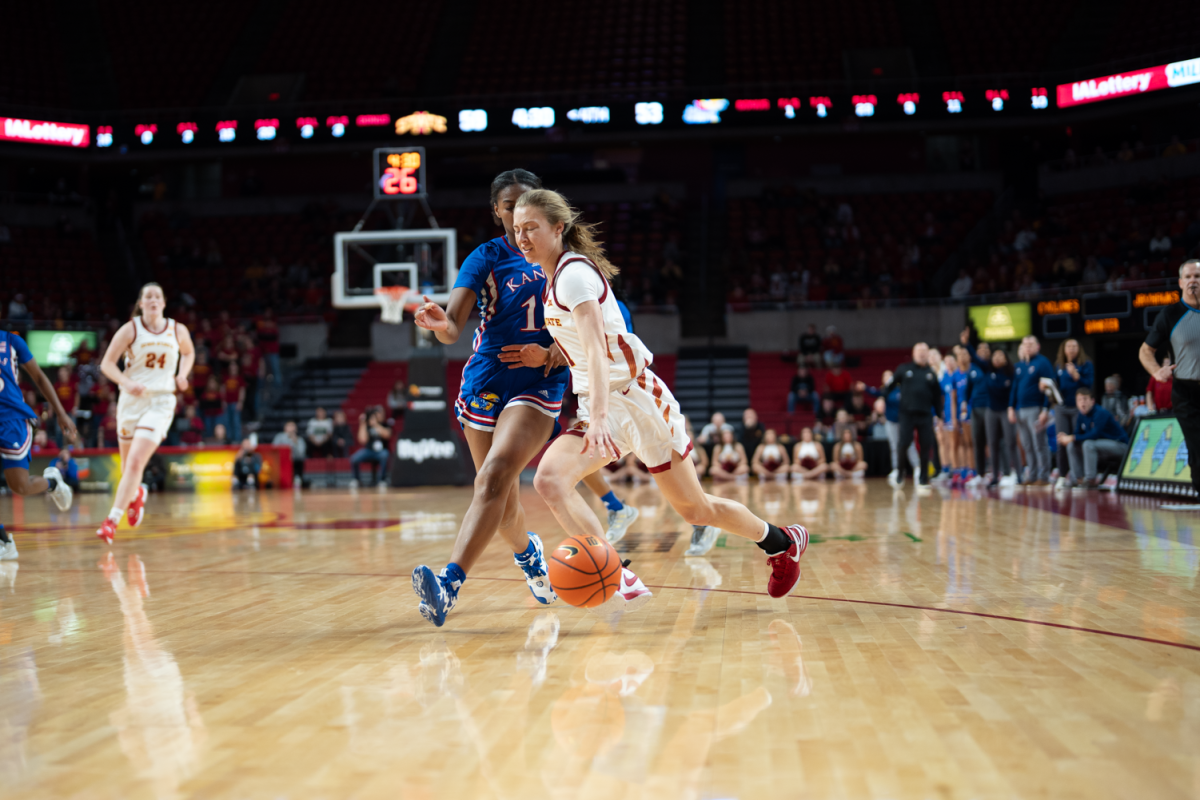 Emily Ryan drives the ball against Kansas at Hilton Coliseum on Jan. 3, 2023.