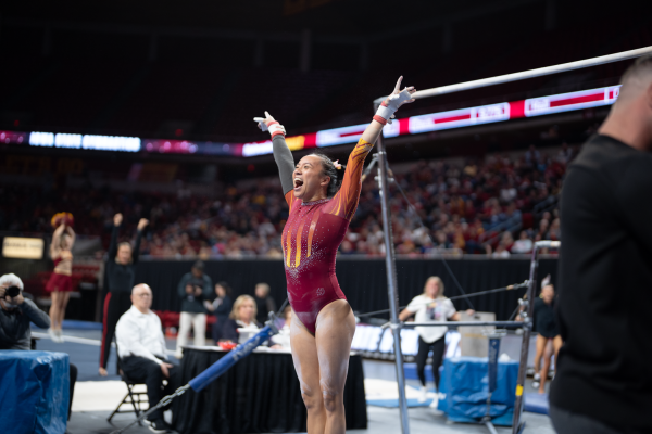 Gymnast sticks the landing after peforming bars against Nebraska at Hilton Coliseum on Jan. 5, 2023.