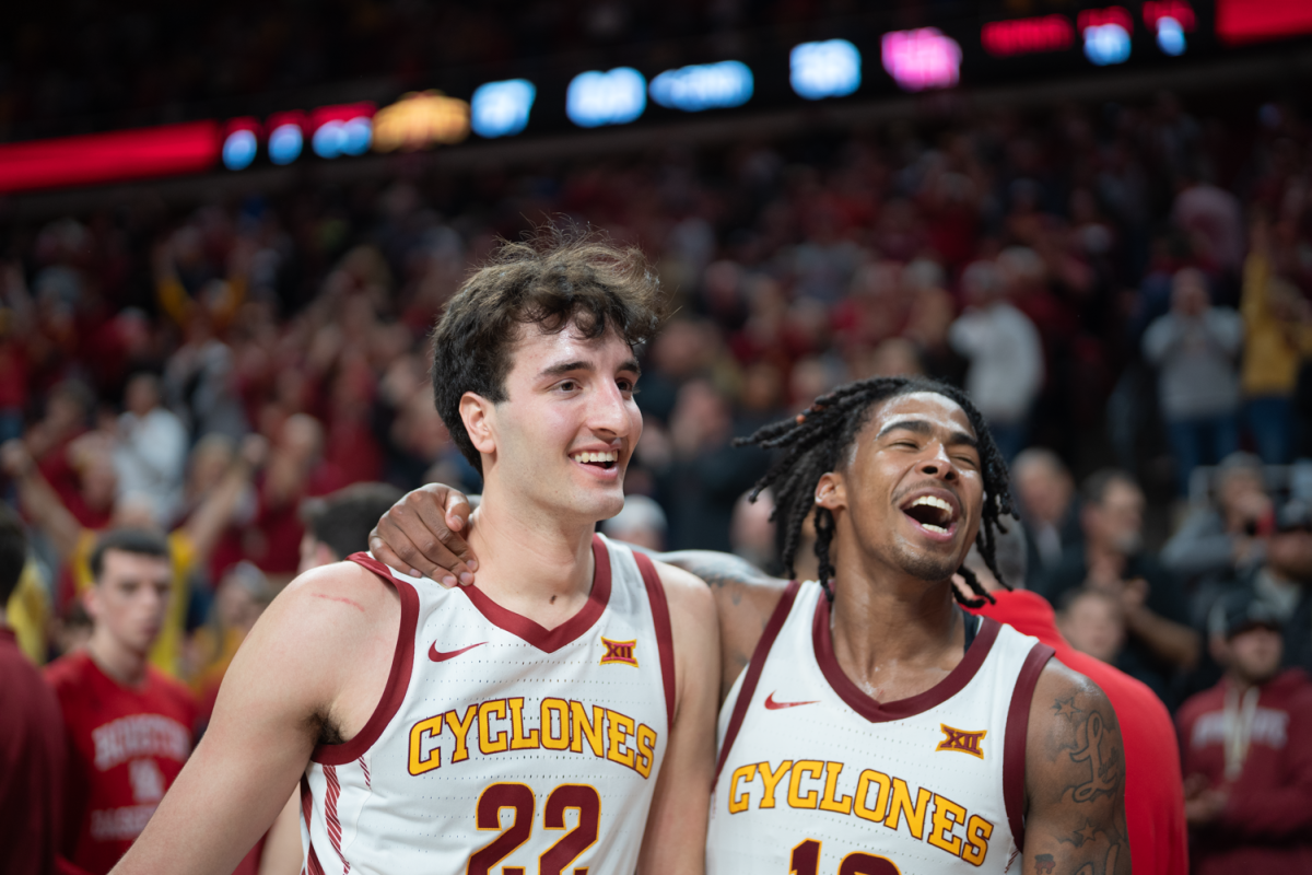 Milan Momcilovic walks off the court with Keshon Gilberts arm around his shoulder after Iowa State beats undefeated Houston 57-53 at Hilton Coliseum on Jan. 9, 2023.