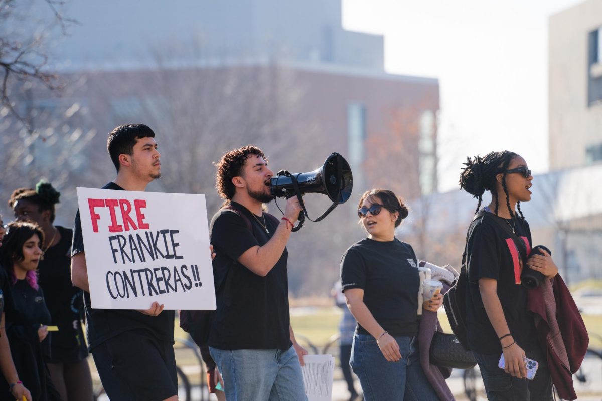Emiliano Alvarado (Left), Endi Montalvo-Martinez (Middle left), Bela Banegas (Middle right)and Lyric Sellers (Right) lead the protest group past Parks Library towards the Armory demanding the immediate firing of ISUPD Officer Frankie Contreras on Feb. 1, 2024.