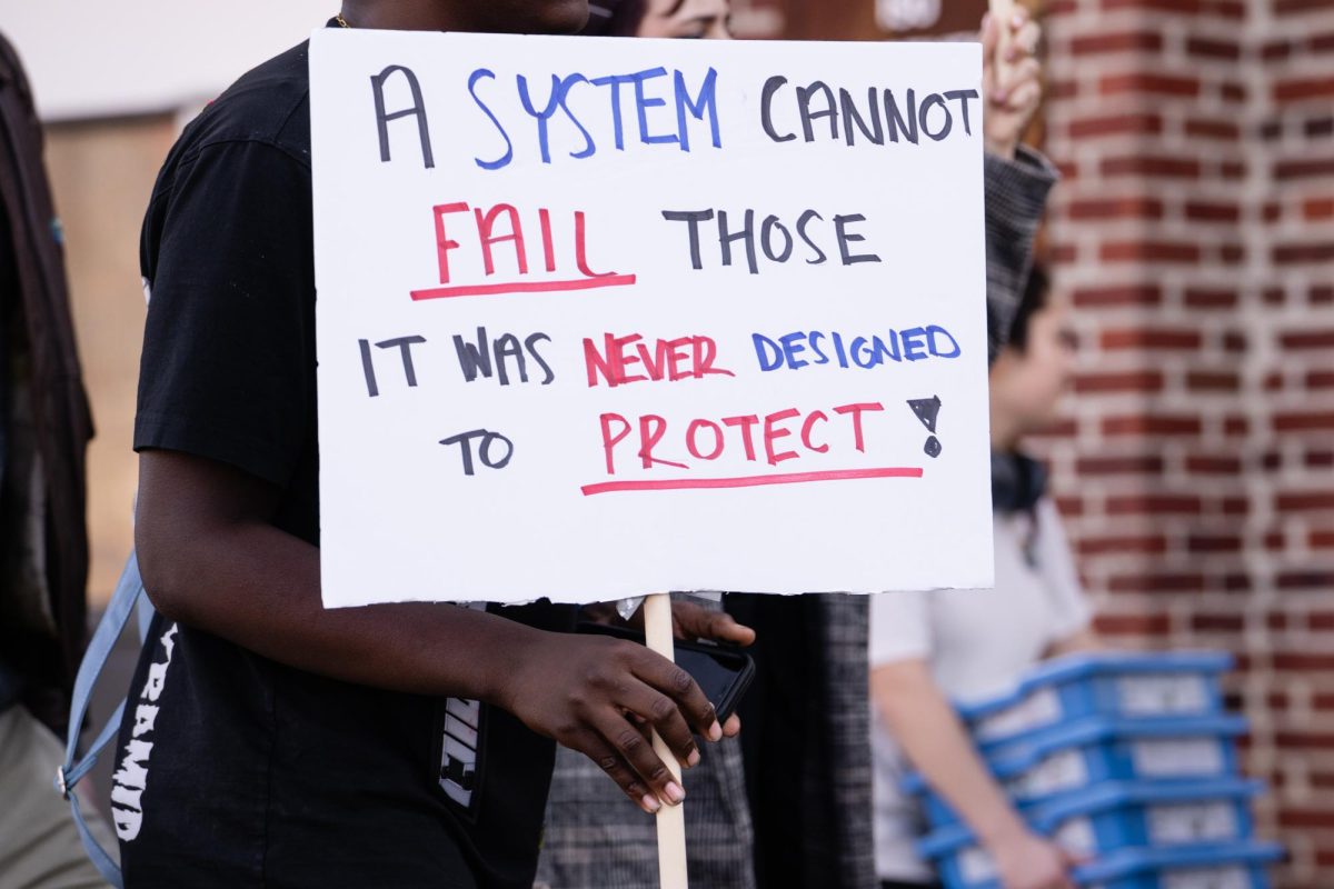 Signage carried during the Color of Love organized protest against ISUPD outside the Armory, Feb. 1, 2024.