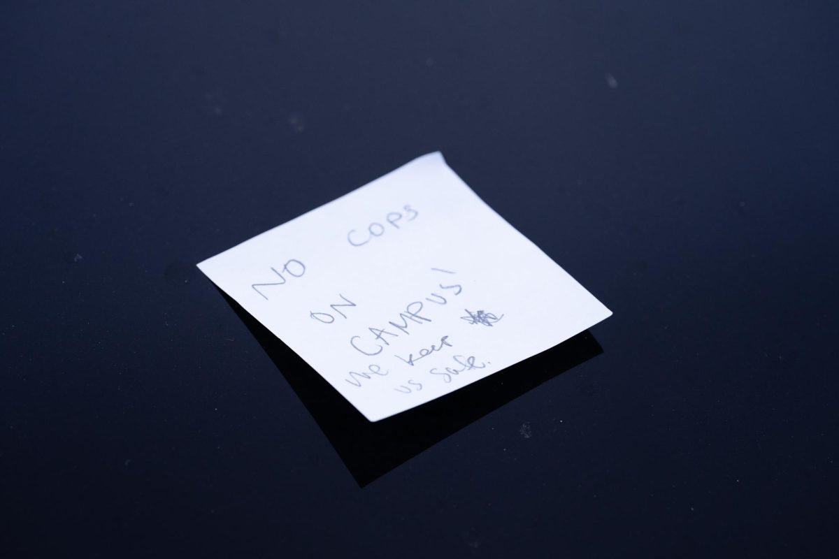 A sticky note placed on vehicles in the Armory parking lot by Color of Love protestors on Feb. 1, 2024. 