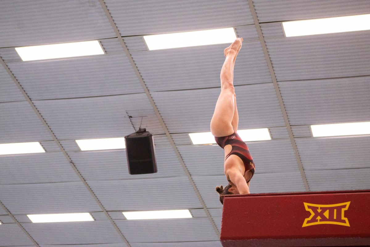 Kate Mitchell competes in the team diving event during the Iowa State swim meet vs Kansas at Beyer Hall on Feb. 9, 2024.