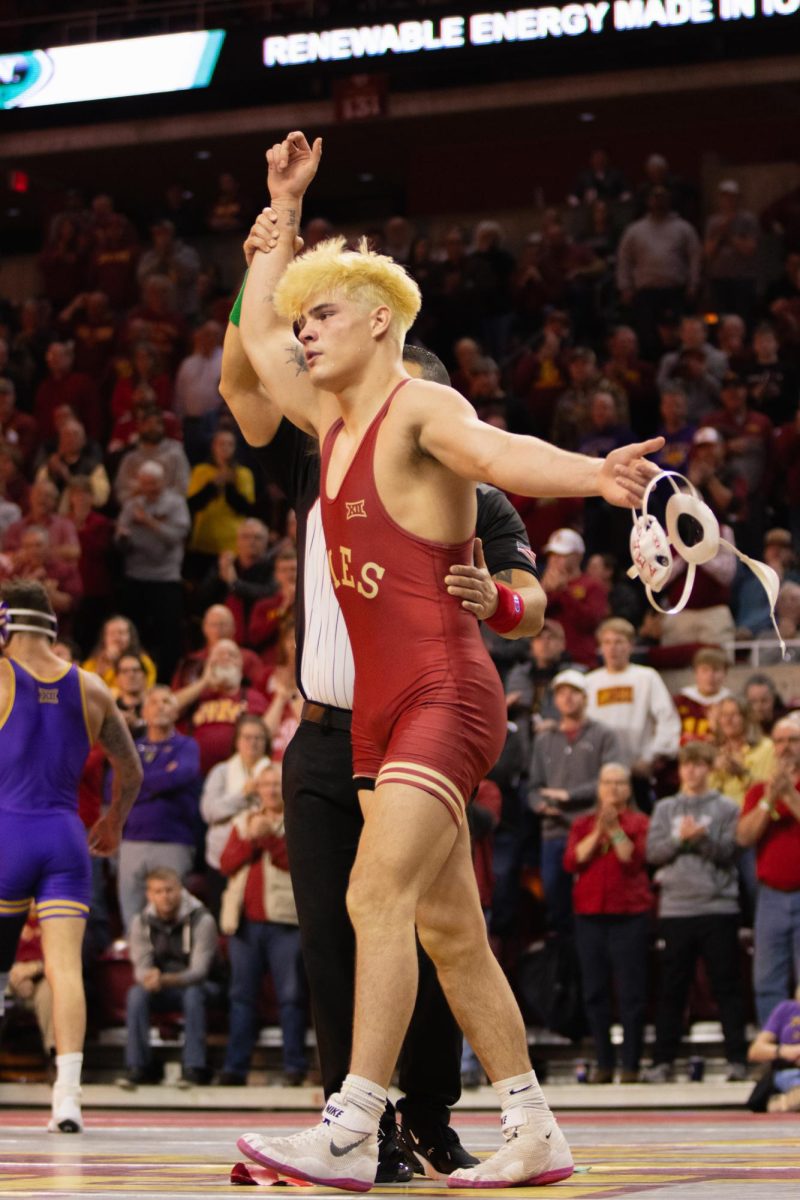 The official holds up MJ Gaitans hand after he wins his match during the ISU vs. UNI wrestling dual on Feb. 11, 2024.