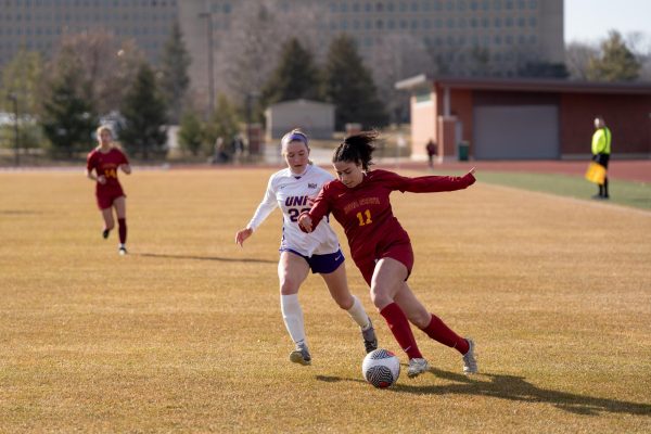 Leia Khairy dribbling past defenders during the Iowa State vs University of Northern Iowa match at Cyclone Sports Complex, Feb. 24, 2024.