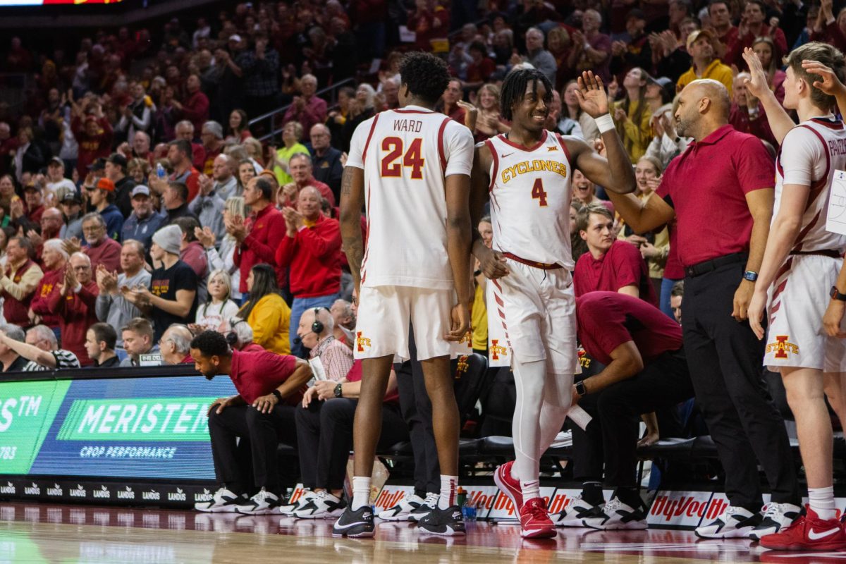 The Iowa State bench gives Demarion Watson (4) praise after his career game during the Iowa State vs Oklahoma basketball game at Hilton Coliseum, Feb. 28, 2024.
