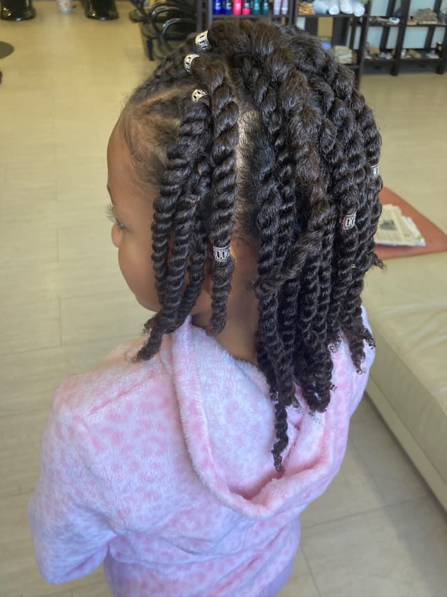 Braids in front with two strand twists in back, done by Pure Luxe stylist Tenia Williams.