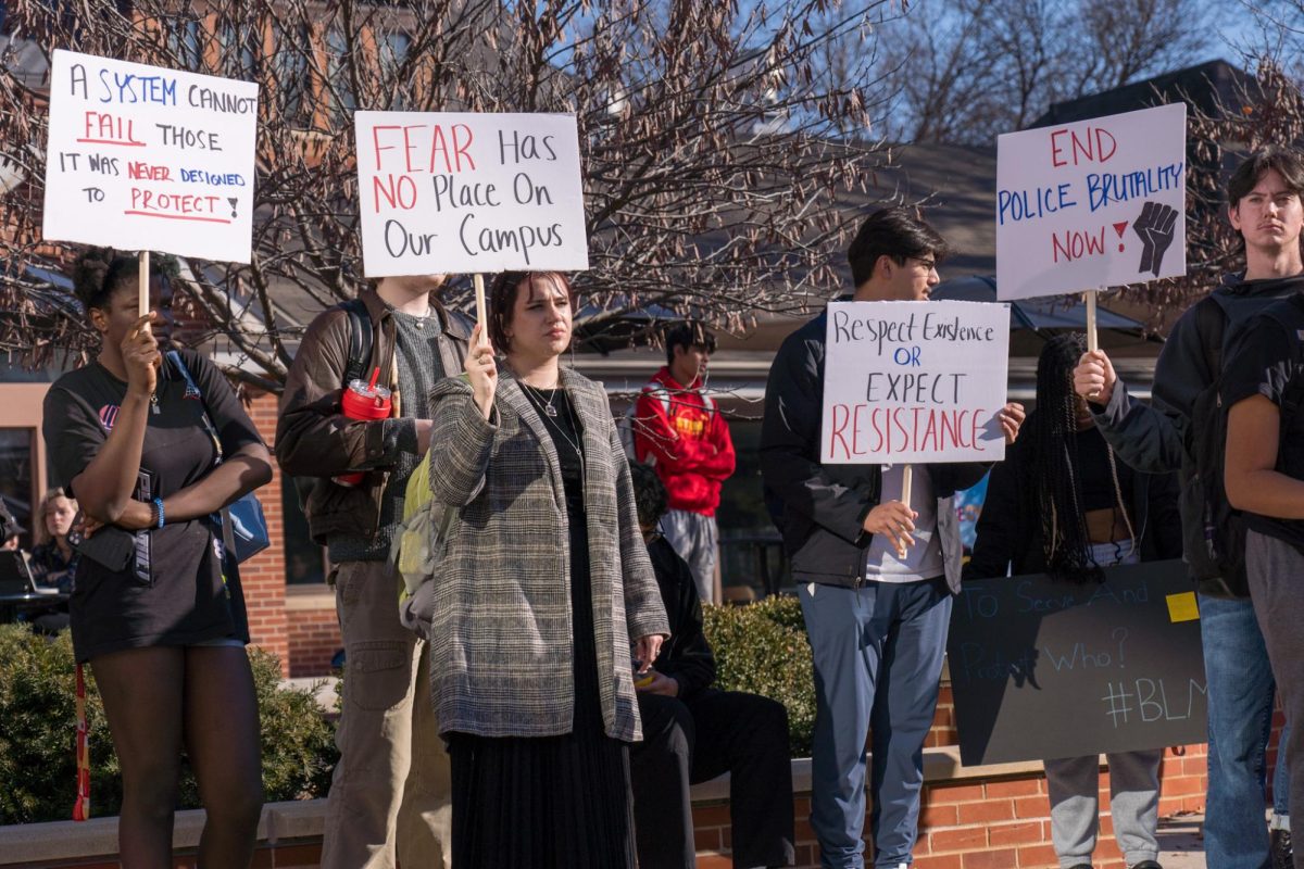 Students holding signs during the Color of Love protest outside of the Parks Library on Feb. 1, 2024. 