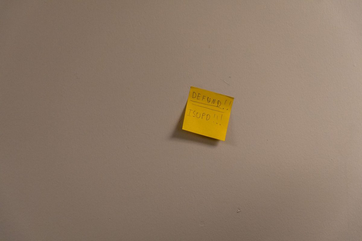 A sticky note demand posted by a protestor at the Armory on Feb. 1, 2024. 