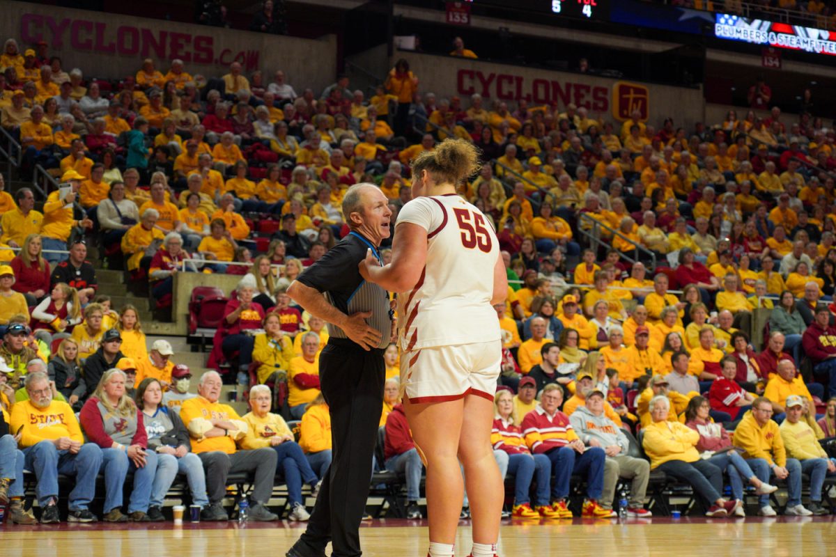 Audi Crooks talks to a ref after a call is made at the Iowa State vs. Oklahoma game in Hilton Coliseum, Feb. 10, 2024.