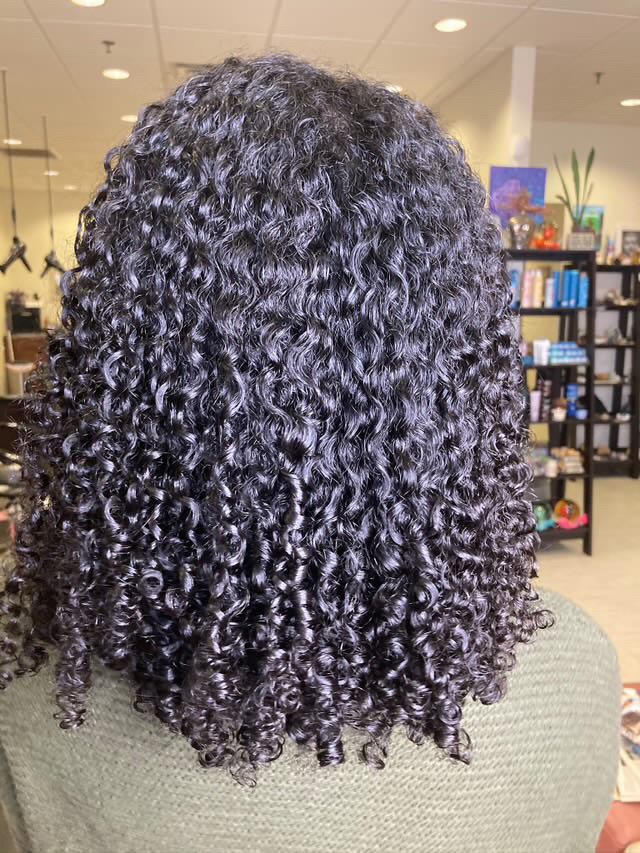 A curly cut, shampoo and conditioning by Pure Luxe stylist Tenia Williams.