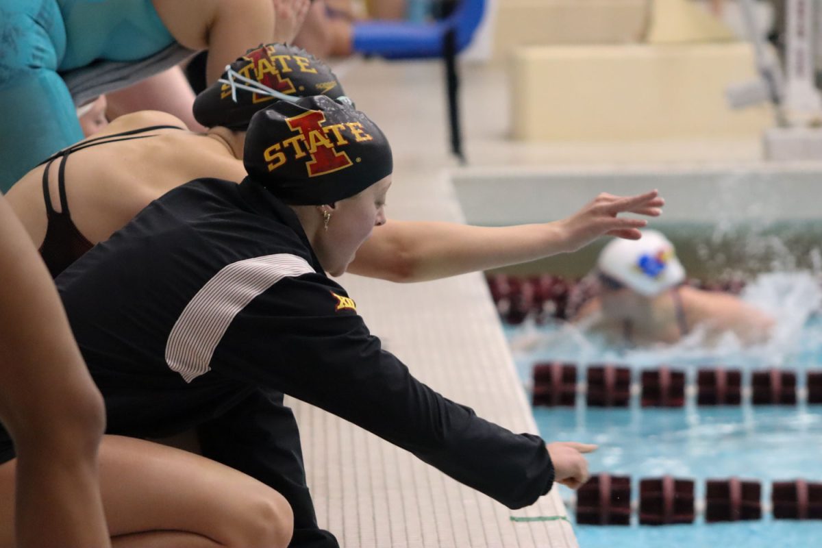 Carley Caughron cheers for her teammate at the Iowa State vs. Kansas swim and diving meet at Beyer Hall on Feb. 9, 2024. 