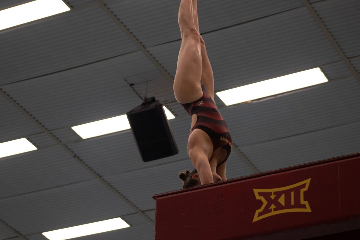 Kate Mitchell gets ready for her turn to dive at the Iowa State vs. Kansas swim and diving meet at Beyer Hall on Feb. 9, 2024. 