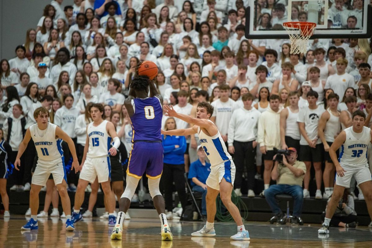 Omaha Biliew and Cade Kelderman play against each other in the home town rivalry game between Waukee and Waukee Northwest, Waukee Northwest High School, Dec. 6, 2022.