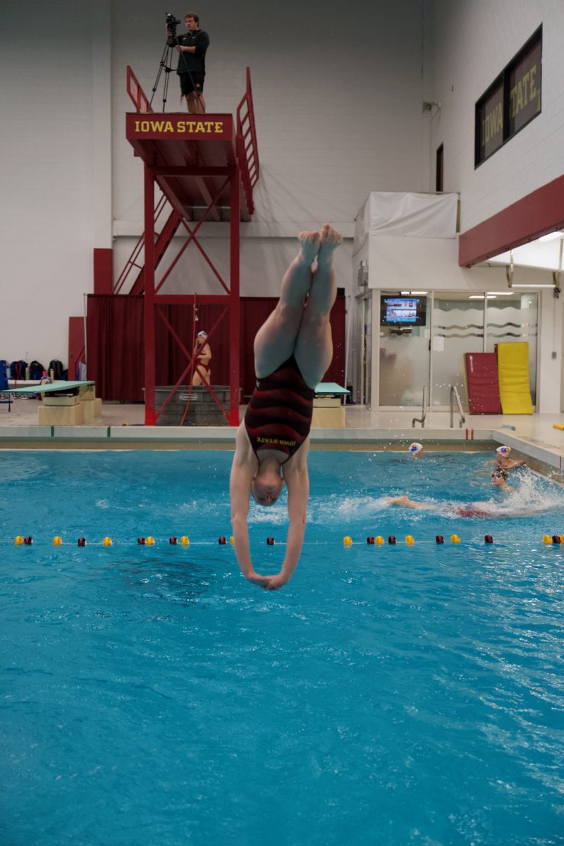 Lauren Kimball diving into the water at Iowa State swim meet vs Kansas at Beyer Hall on Feb. 10, 2024.