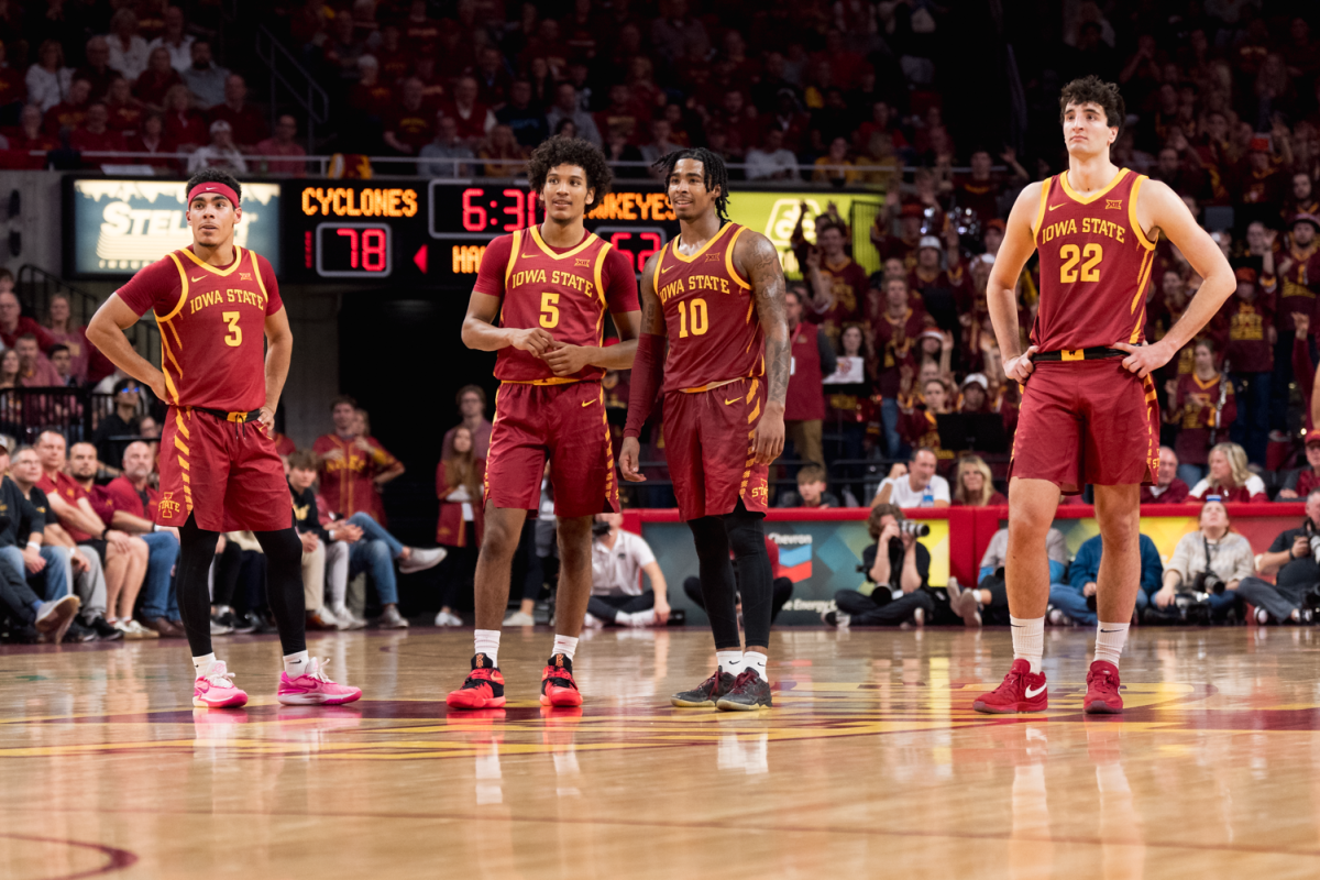 Curtis Jones (5) and Keshon Gilbert (10) chat at half-court during free throws against Iowa in the CyHawk game at Hilton Coliseum on Dec. 7, 2023