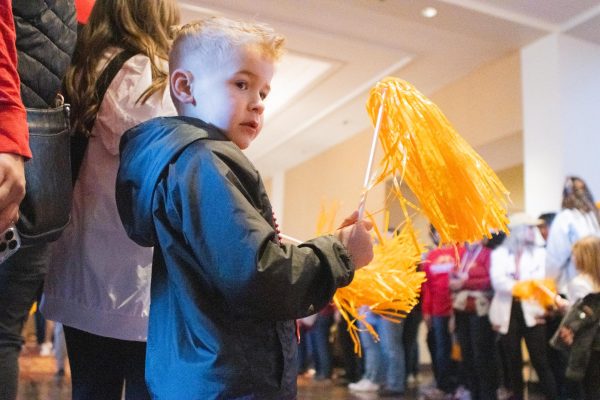 A young Iowa State fan waves his pom pom to cheer on the Cyclones before the Big 12 basketball tournament on Mar. 9, 2024 in Kansas City, MO.