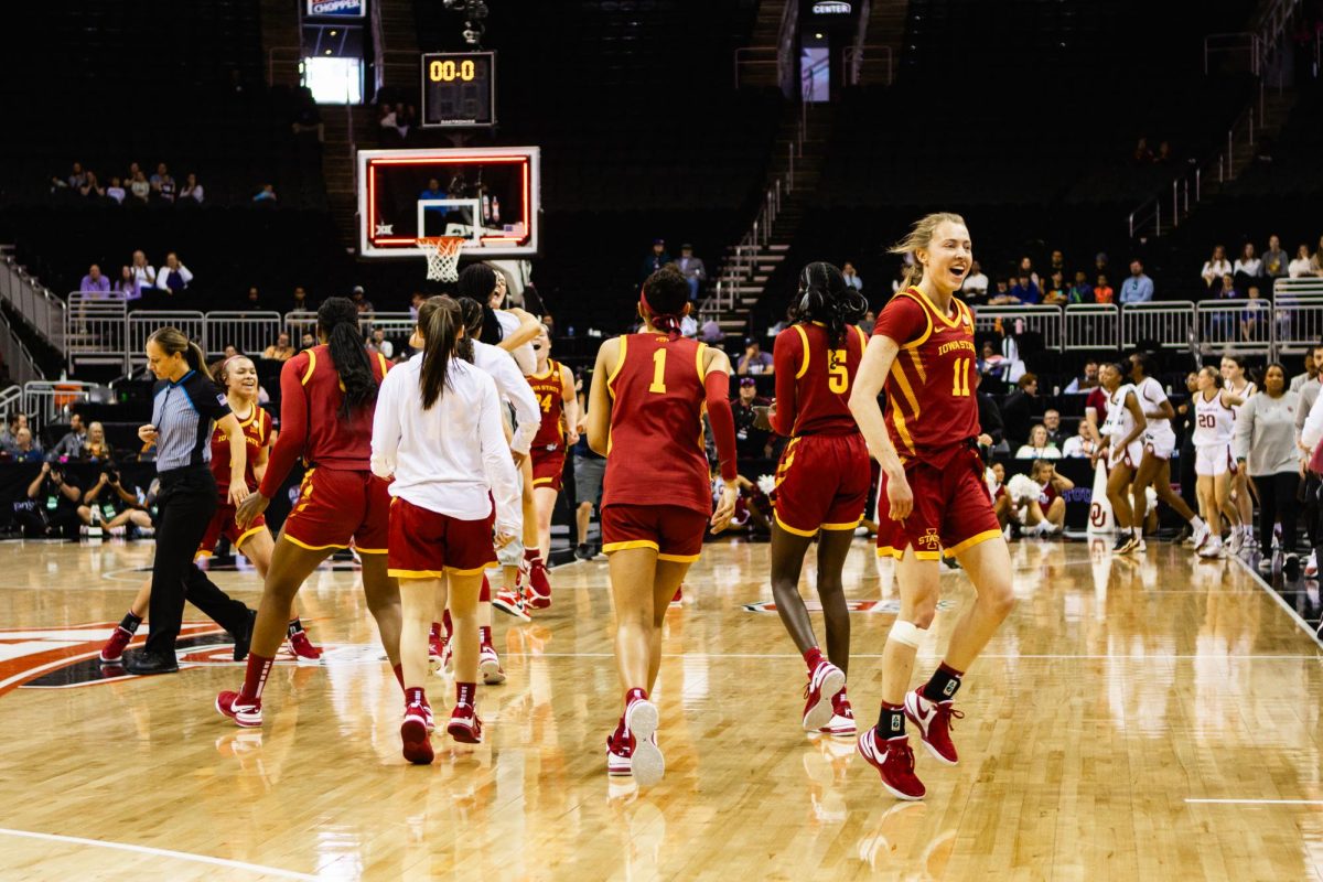 The Iowa State team celebrates after upsetting Oklahoma in the semi-finals of the Big 12 Tournament at T-Mobile Center, March 11, 2024.