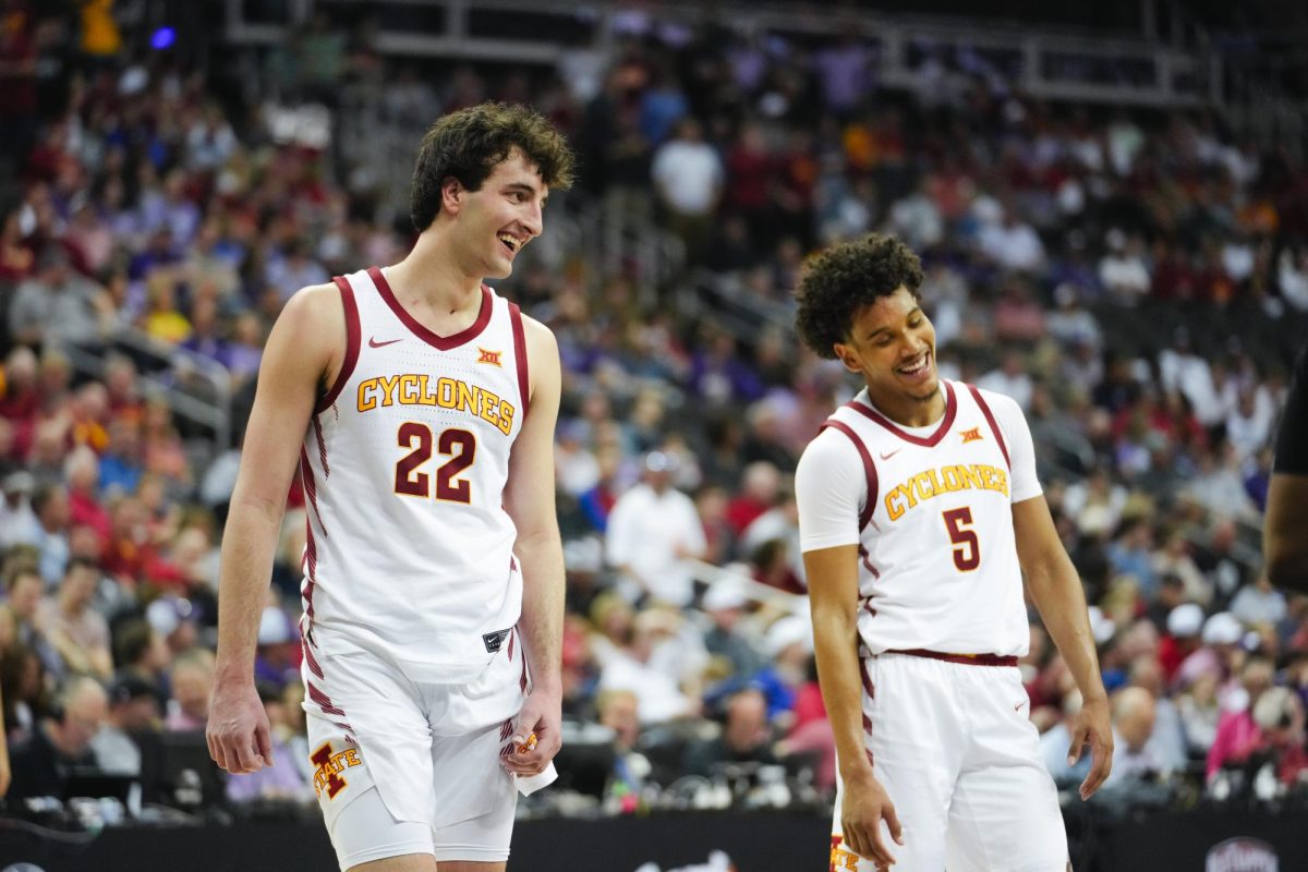 Milan Momcilovic and Curtis Jones smile as Cade Keldermans name is announced for a sub during the final minutes of the Big 12 mens basketball tournament game against Kansas State, T-Mobile Center, Kansas City on March 14, 2024.