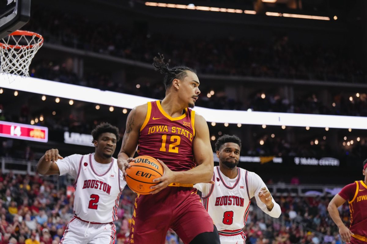 Robert Jones looks for an open teammate to pass the ball to during the mens basketball Big 12 Championship game against Houston, T-Mobile Center, Kansas City, March 16, 2024.