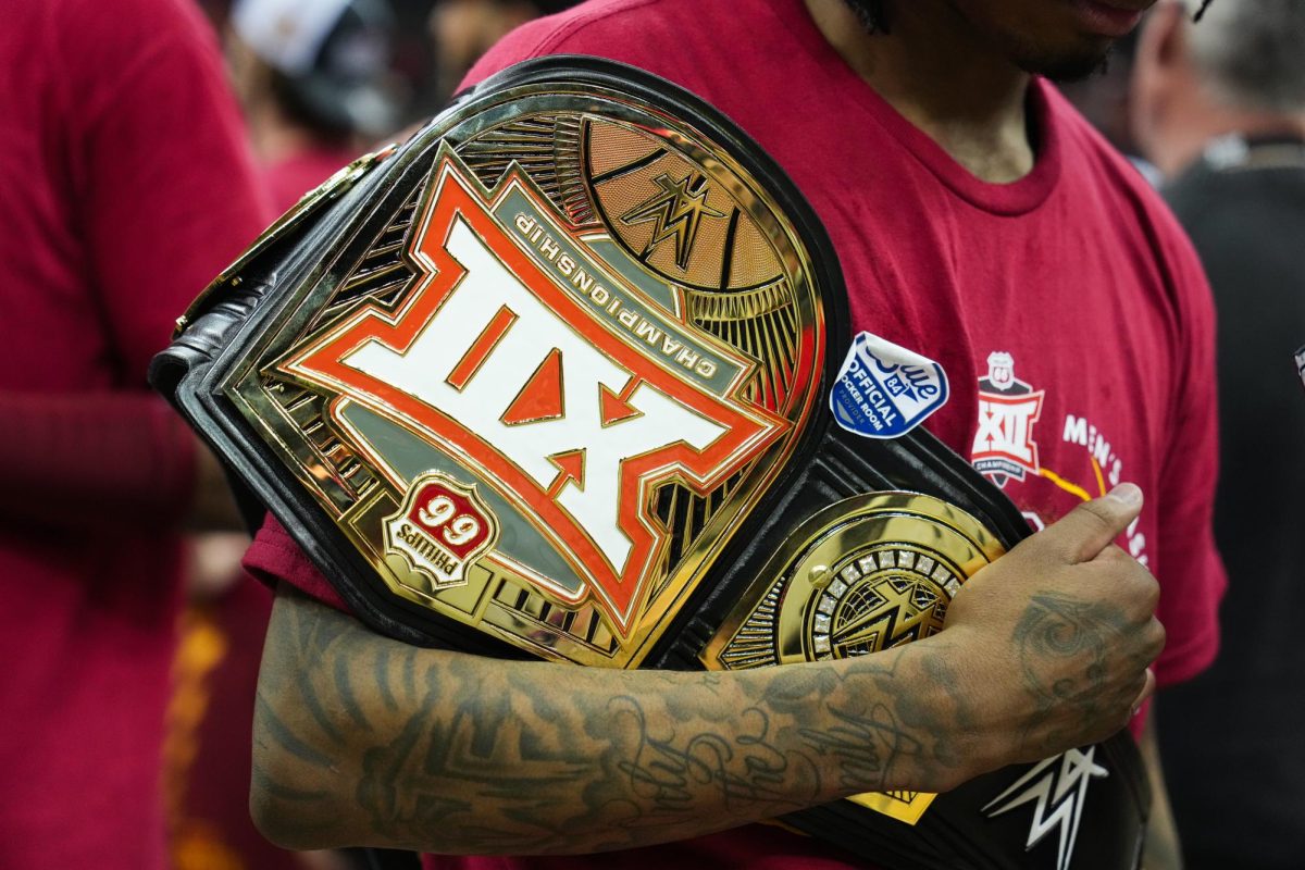 Keshon Gilbert holds his MOP belt after the mens basketball Big 12 Championship game against Houston, T-Mobile Center, Kansas City, March 16, 2024.