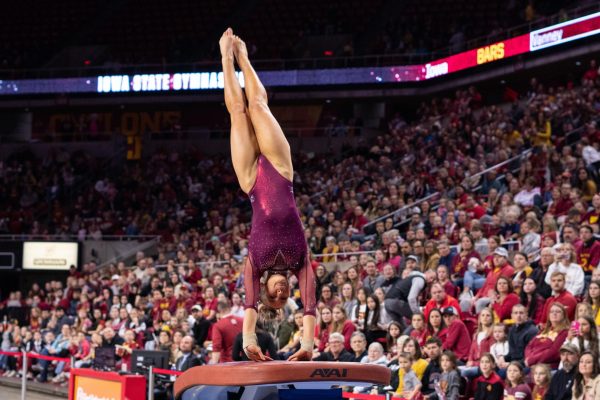 Josie Bergstrom vaults during her routine as part of the Iowa Corn Cy-Hawk series gymnastics meet against the University of Iowa, Hilton Coliseum, March 8, 2024.