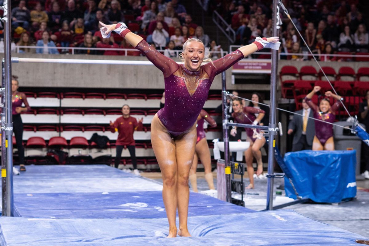 Laura+Cooke+sticks+the+landing+after+her+bars+routine+as+part+of+the+Iowa+Corn+Cy-Hawk+series+gymnastics+meet+against+the+University+of+Iowa%2C+Hilton+Coliseum%2C+March+8%2C+2024.