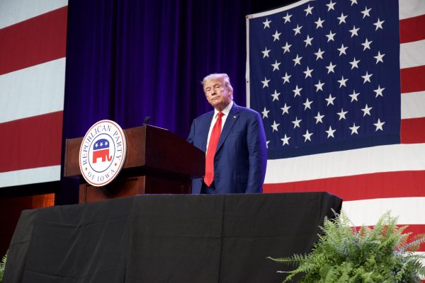 Former President Donald Trump stands at the podium of the 2023 Iowa GOP Lincoln Dinner on July 28, 2023.