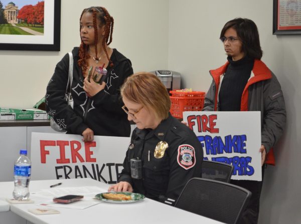 ISUPD Assistant Chief Carrie Jacobs reads through Color of Loves revised list of demands during the ISUPD Advisory Board meeting in the Armory on Monday, March 25, 2024.