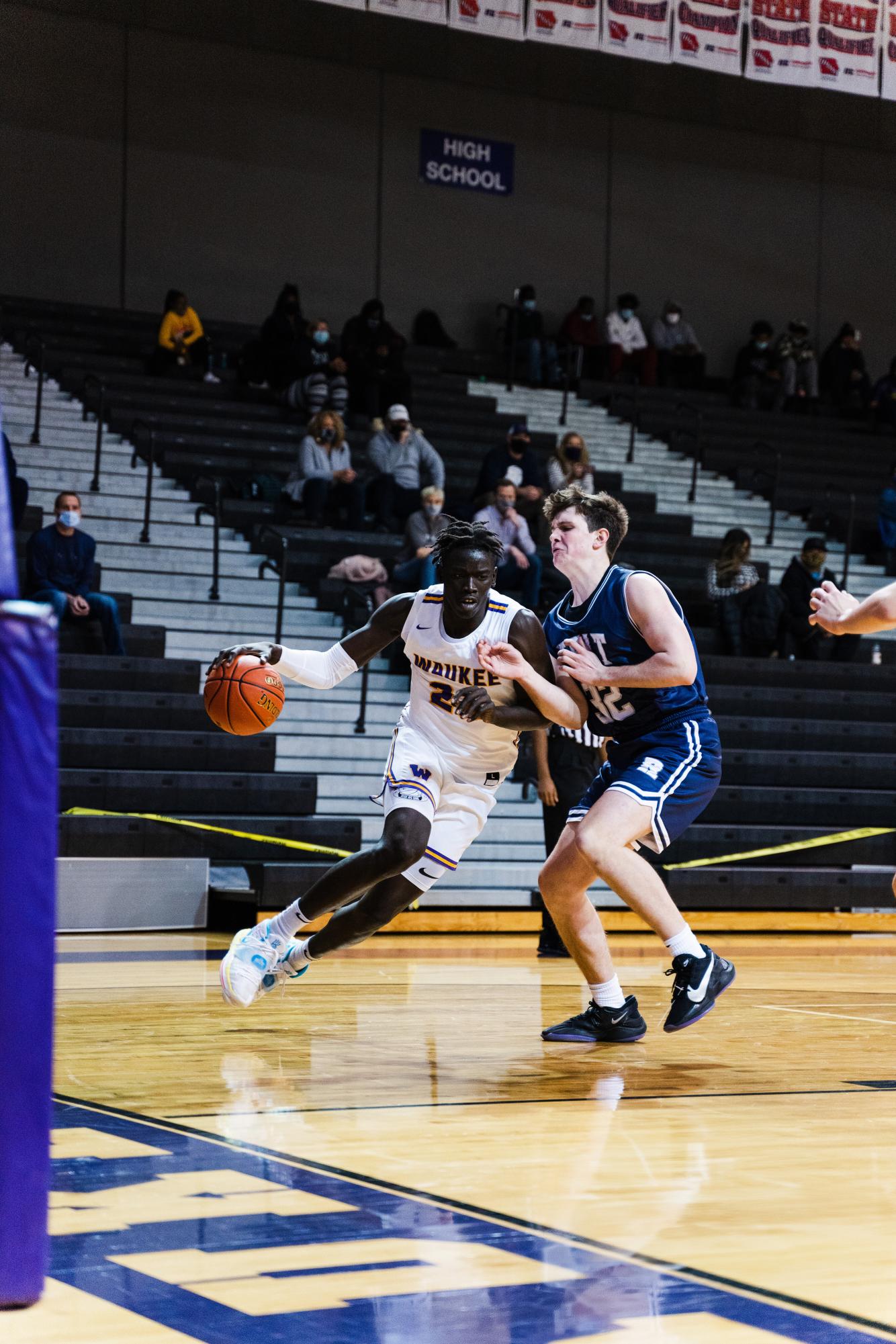 Sophomore Omaha Biliew drives the ball toward the paint during a game against Des Moines Roosevelt. Waukee won 74-37. Waukee High School, Jan. 9, 2021. 