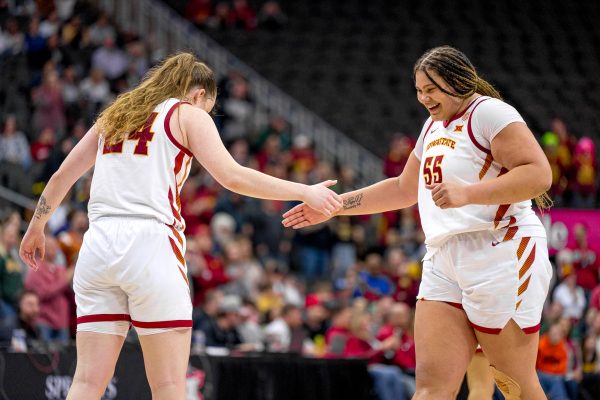 Audi Crooks celebrates with teammate Addy Brown after making a goal against Baylor during the womens Big 12 Tournament game on March 9, 2024 in the T-Mobile Center, Kansas City.